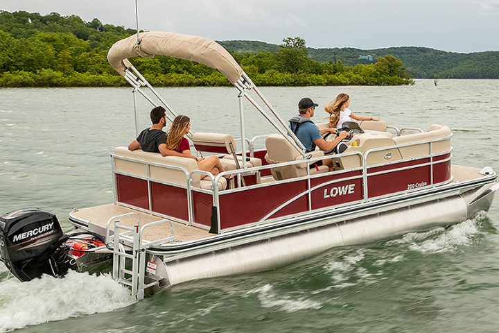 a group of people in a small boat in a body of water